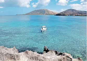  ?? | ?? BLESSED with dramatic peaks and sun-drenched white-sand beaches, the Yasawa Islands are the quintessen­tial paradise spot in Fiji. Unsplash