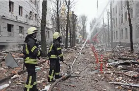  ?? ANDREW MARIENKO/AP, FILE ?? Firefighters extinguish a Ukrainian Security Service building after a rocket attack in Kharkiv, Ukraine, on March 2.