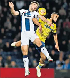  ??  ?? Collision: West Brom’s James Morrison (left) and Kemar Roofe challenge for the ball