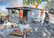  ?? (AFP) ?? This file photo shows a house in flames in the village of Charektar outside the town of Kalbajar, on November 14, 2020