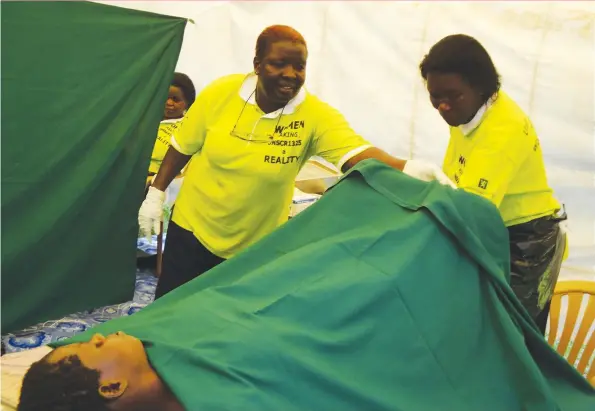  ??  ?? A woman being screened for cervical cancer