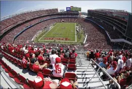  ?? TONY AVELAR — THE ASSOCIATED PRESS FILE ?? Fans watch during a game between the San Francisco 49ers and the Carolina Panthers at Levi's Stadium in Santa Clara in 2017. There are 23venues bidding to host soccer matches at the 2026World Cup in the United States, Mexico and Canada.