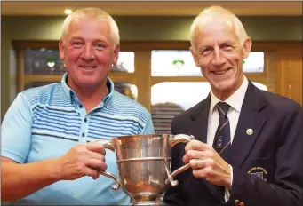  ??  ?? Seamus Aldridge, winner of the Club Cup in New Ross sponsored by Prim-Ed, with Martin Carroll (Captain).