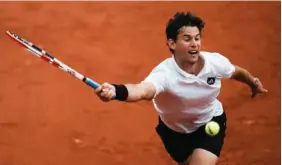  ?? AP PHOTO/THIBAULT CAMUS ?? Dominic Thiem plays a shot against Hugo Dellien during a first-round match Sunday at the French Open. Thiem, a two-time finalist at the event, lost in straight sets to extend his overall losing streak to 10 matches.