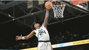  ?? PHELAN M. EBENHACK/AP ?? UCF guard Jaylin Sellers dunks for two of his 10 first-half points against No. 8 Iowa State on Saturday at Addition Financial Arena.