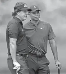  ?? SAM GREENWOOD/GETTY IMAGES ?? Phil Mickelson and Tiger Woods will square off for The Match on Friday at Shadow Creek.