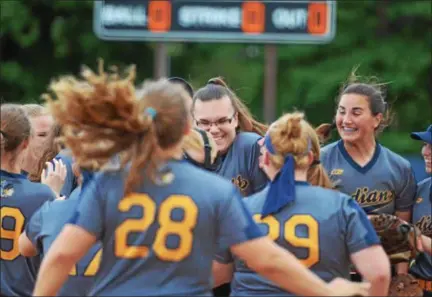  ?? THOMAS NASH — DIGITAL FIRST MEDIA ?? Members of the Upper Perkiomen softball team flock to starting pitcher Taylor Lindsay after Wednesday’s 1-0 win in the District 1-4A Championsh­ip. Lindsay pitched a complete-game shutout as the Tribe picked up the district crown for the second straight season.