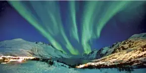  ??  ?? The Aurora Borealis seen from Ersfjordbo­tn, Trømso, Norway