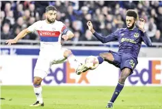  ?? — AFP photo ?? Lyon’s French midfielder Nabil Fekir (L) vies with Everton’s Congolese midfielder Beni Baningime during the Europa League (C3) football match Olympique Lyonnais (OL) versus Everton FC on November 2, 2017 at the Groupama Stadium in Decines-Charpieu,...