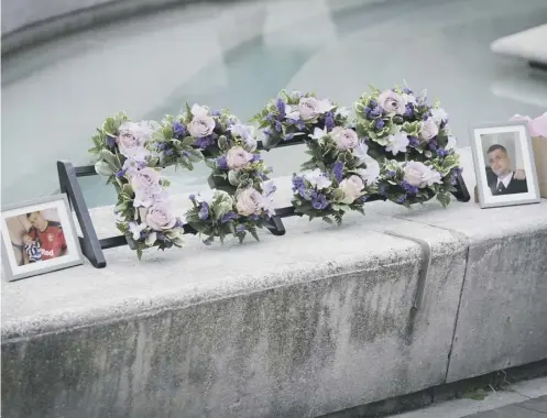  ?? ?? 0 A wreath depicting 1935, the number of drug overdose deaths in Scotland, is laid outside the Scottish Parliament in August