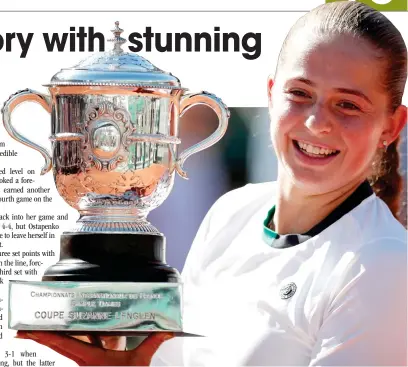  ??  ?? Latvia's Jelena Ostapenko celebrates with the trophy after winning the final against Romania's Simona Halep in the French Open on Saturday at Roland Garros. (AFP)