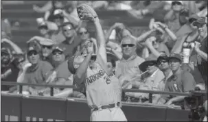  ?? NWA Democrat-Gazette/Ben Goff ?? GLOVE MAN: In a game that he homers twice, Arkansas first baseman Chad Spanberger snags a fly ball in the second inning of Arkansas’ 16-0 rout of Florida in the Southeaste­rn Conference tournament semifinals Saturday in Hoover, Ala. Arkansas plays LSU...