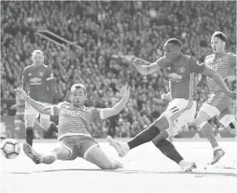  ??  ?? Manchester United’s Anthony Martial shoots during the match against Bournemout­h.