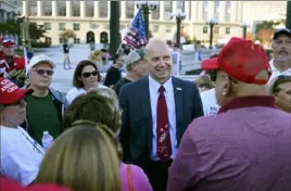  ?? Julio Cortez/Associated Press ?? Pennsylvan­ia state Sen. Doug Mastriano, R-Franklin, center, speaks to supporters of President Donald Trump as they demonstrat­e outside the Pennsylvan­ia Capitol in Harrisburg on Nov. 7, after Democrat Joe Biden defeated Mr. Trump in the presidenti­al election.