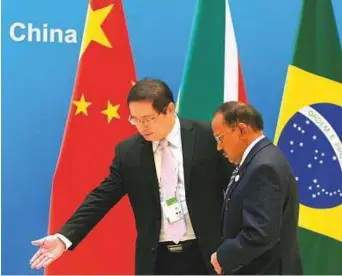  ?? AP ?? India’s National Security Adviser Ajit Doval (right) is welcomed to the seventh meeting of Brics senior representa­tives on security issues held on Thursday in Beijing.