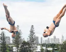  ??  ?? James Heatly and Lucas Thomson of Scotland train ahead of the men’s synchronis­ed 10m platform diving final at the Aquatic Centre.