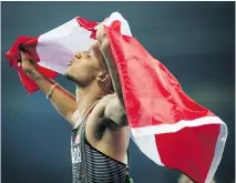  ?? TYLER ANDERSON ?? Andre De Grasse holds a Canadian flag as he celebrates his bronze finish in the men’s 100-metre final Aug. 14.