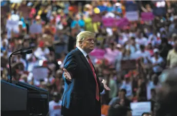  ?? Doug Mills / New York Times ?? President Trump, shown at a “Make America Great Again” rally at an auditorium in Tampa, Fla., is underminin­g the rise of the black middle class.