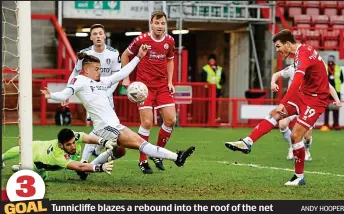  ?? ANDY HOOPER ?? 3 GOAL Tunnicliff­e blazes a rebound into the roof of the net