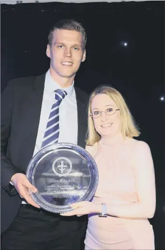  ?? Picture: Robin Jones ?? UNCERTAIN FITURE Sean Raggett receives an award from Gemma Raggett (no relation) from Portsmouth FC Supporters Club London - one of eight awards he collected during the evening’s ceremony