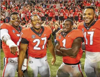  ?? CURTIS COMPTON / CCOMPTON@AJC.COM ?? UGA linebacker Lorenzo Carter (from left), running backs Nick Chubb and Sony Michel and linebacker Davin Bellamy were all invited to the NFL combine. UGA will have 10 players in Indianapol­is. Alabama and Ohio State are the only schools with more...