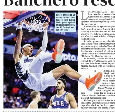  ?? (AFP) ?? PAOLO BANCHERO of Orlando finishes a twohanded dunk during their game against Philadelph­ia on Monday, Jan. 30. The Magic won, 119-109.