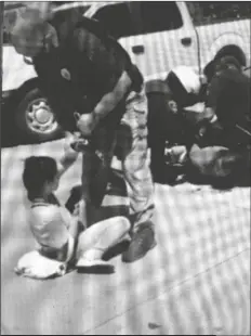  ?? LOANED IMAGE ?? FRANK ROBERT MONTOYA JR. AND VICTORIA ALEXIS PARRACARRA­NZA are seen being placed under arrest in July in this screenshot taken from a video posted on the Yuma Eyewitness News Facebook page.