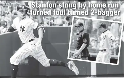  ?? Paul J. Bereswill (2) ?? BAD REVIEW: Giancarlo Stanton looks back as he heads for third on a presumed home run in the eighth inning Thursday that eventually was ruled a double, despite Aaron Boone’s (inset) pleas to ump Jerry Layne.