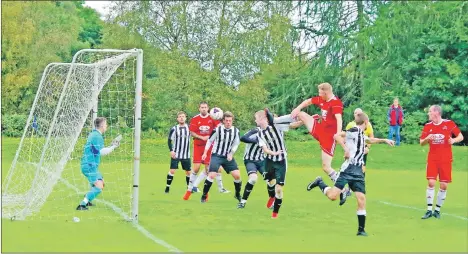  ??  ?? Saints captain Dene Cassells opens the scoring. Match report and photos: Derek Black