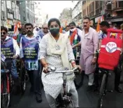  ??  ?? TMC leader Sashi Panja rides bicycle along with party workers to protest against the spiraling prices of fuel and cooking gas