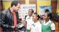  ?? FILE ?? Tarik Kiddoe, motorcycle safety expert, giving some safety tips to students from Mona Heights Primary in this May 11, 2017, file photo. Kiddoe recently called for the establishm­ent of a national motorcycle safety reform committee.