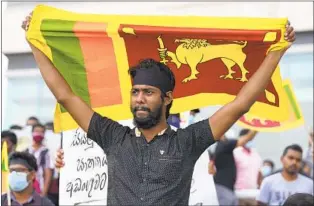  ?? ERANGA JAYAWARDEN­A AP ?? Sri Lankans protest Saturday, demanding the resignatio­n of President Gotabaya Rajapaksa and his government, in Colombo, Sri Lanka. Sri Lankans continue to face shortages of food and fuel.