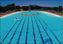  ?? CONTRIBUTE­D ?? Coney Island officials say the park’s Sunlite Pool, with more than 3 million gallons of water, is the world’s largest flat-surfaced recirculat­ing pool. The park is located east of Cincinnati.