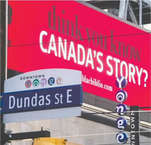  ?? PETER J. THOMPSON / NATIONAL POST ?? Toronto’s Dundas St. is named after Henry Dundas, below. The billboard behind is promoting Black History Month.