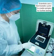  ?? ?? Scientists use a thermostat­ic cycler to create samples for further testing