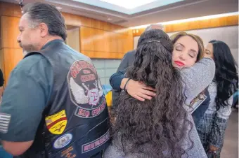  ?? EDDIE MOORE/JOURNAL ?? Rep. Sarah Maestas Barnes, R-Albuquerqu­e, right, hugs Melissa Craig of Albuquerqu­e after the House Consumer and Public Affairs Committee approved her proposed expansion of “Baby Brianna’s Law.”