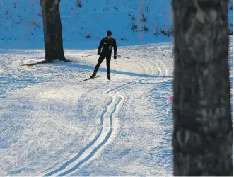  ?? GAVIN YOUNG ?? A cross-country skier enjoys the trails Thursday at Confederat­ion Park Golf Course, which is being improved thanks to $87,000 in funding raised by Foothills Nordic Ski Club in just over a month.