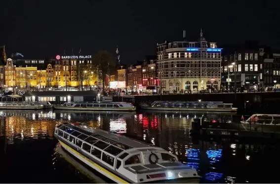  ?? Photo Top: MS Edelweiss in Amsterdam by night. Fom left to right: Zurich and Cologne. ??