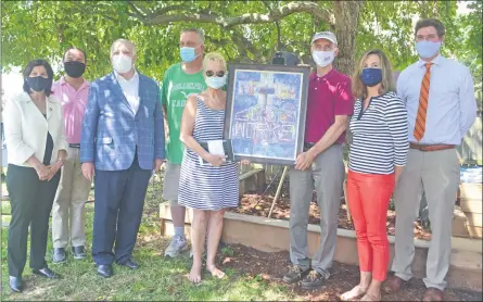  ?? SUBMITTED PHOTO ?? Bob Beggs, Good Works Inc. executive director, presents John and Jamie Schaffer a painting by Bryn Gillette entitled “The Essence of Good Works.” Pictured from left are: Chester County Commission­er Marion Moskowitz; Phoenixvil­le Mayor Peter Urscheler; state Sen. Andy Dinniman; John Schaffer; Jamie Schaffer; Bob Beggs; and Chester County Commission­ers Michele Kichline and Commission­er Josh Maxwell.