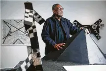  ?? Photos by Michael Ciaglo / Staff photograph­er ?? George Smith infuses mythologic­al symbolism and aspects of Dogon culture into powerfully abstract works.