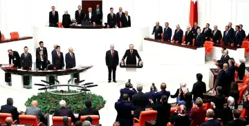  ??  ?? Erdogan is applauded by lawmakers after he took the oath of office for a new presidenti­al term at the Parliament in Ankara, Turkey. — Reuters photo