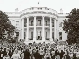  ?? Mandel Ngan / Getty Images ?? President Donald Trump speaks to several hundred followers from a White House balcony during what was described as a “peaceful protest for law & order.”