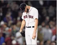  ?? David J. Phillip / Associated Press ?? Boston Red Sox starting pitcher Chris Sale reacts after giving up a two-run double to the Houston Astros’ Yordan Alvarez during the sixth inning in Game 5 of the ALCS on Wednesday.