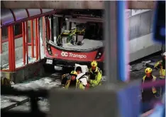  ?? PRESS JUSTIN TANG/THE CANADIAN ?? Police and a first responders work at the scene of the horrific bus crash Friday that left three dead and 23 injured.