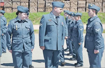  ?? ERIC MCCARTHY/JOURNAL PIONEER ?? Flight Sergeant Julie Gallant, parade commander for the 641 West Prince Air Cadet Squadron, looks on as Master Corporal Landon Yuill conducts the squadron’s annual parade inspection. He stops to speak with Corporal Jayden Doucette, right. During the...