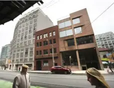  ?? RICHARD LAUTENS/TORONTO STAR ?? The Richmond St. building on the right houses Cornerston­e.