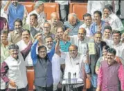  ?? AP ?? Karnataka CM HD Kumaraswam­y, state minister DK Shivakumar, deputy CM G Parameshwa­ra and others celebrate after presenting the 2019-20 budget at Vidhan Soudha, Bengaluru, on Friday.