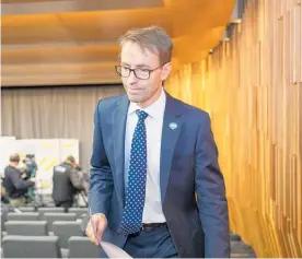  ?? Photo / Mark Mitchell ?? Director general of health Dr Ashley Bloomfield leaves his press conference at the National Library in Wellington yesterday.