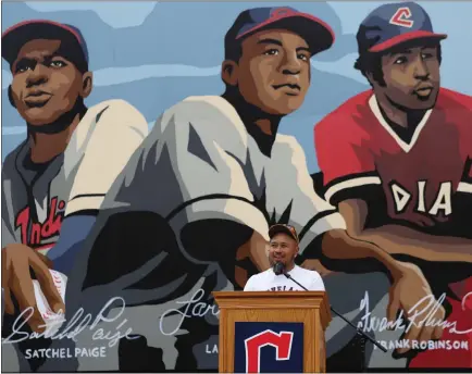  ?? COURTESY CLEVELAND GUARDIANS ?? Artist Glen Infante speaks July 1in front of a mural outside Progressiv­e Field honoring Larry Doby, Frank Ronbinson and Satchel Paige.