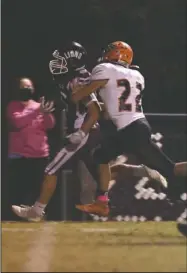  ?? The Sentinel-Record/Corbet Deary ?? MOVING THE BALL: Mount Ida sophomore Jack Hoeksema (16) runs the ball down the field as Magnet Cove junior Brayden Campbell (22) moves in to push him out of bounds in Friday’s game at Mount Ida.